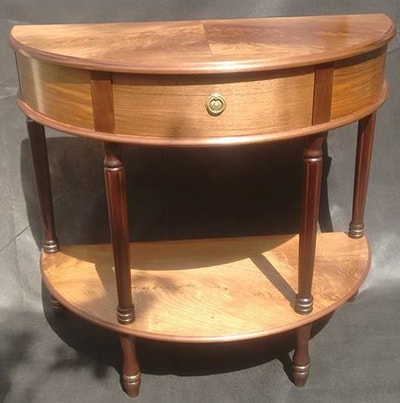 A Traditional European and Black Walnut Demi Lune Console Table. The drawer is made from Cornish Laurel. 