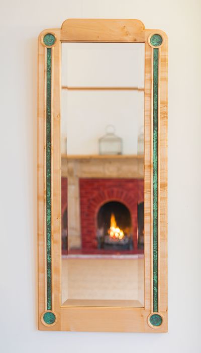 A beautiful Mirror inspired by the Art Deco movement, in English Maple and with patinated copper detail