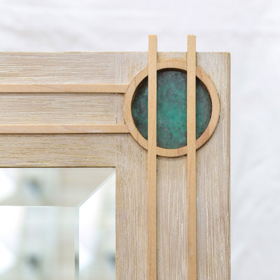 A beautiful mirror inspired by the Art Deco movement, in bleached and lime waxed reclaimed sapele with maple and patinated copper detail